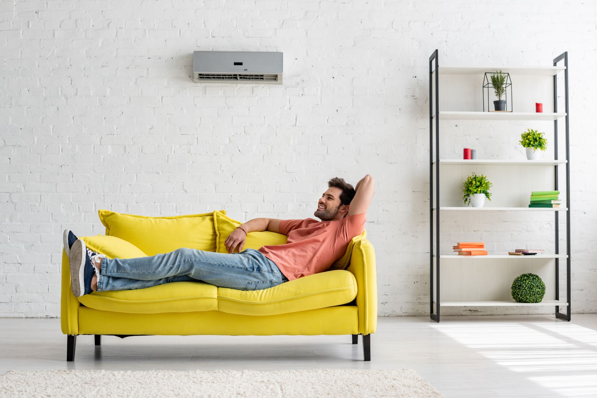 handsome-smiling-man-lying-on-yellow-sofa-under-ai-2021-08-31-03-36-30-utc-1.jpg